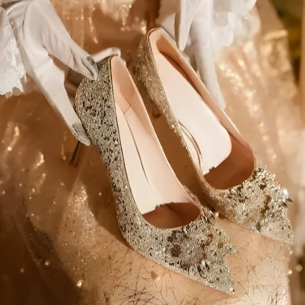 Champagne pointed toe wedding shoes with crystal rhinestone detail on a fine high heel.