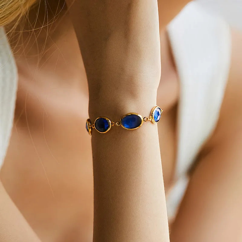 Women's geometric bracelet with elliptical glass inlays on 18K gold-copper framework