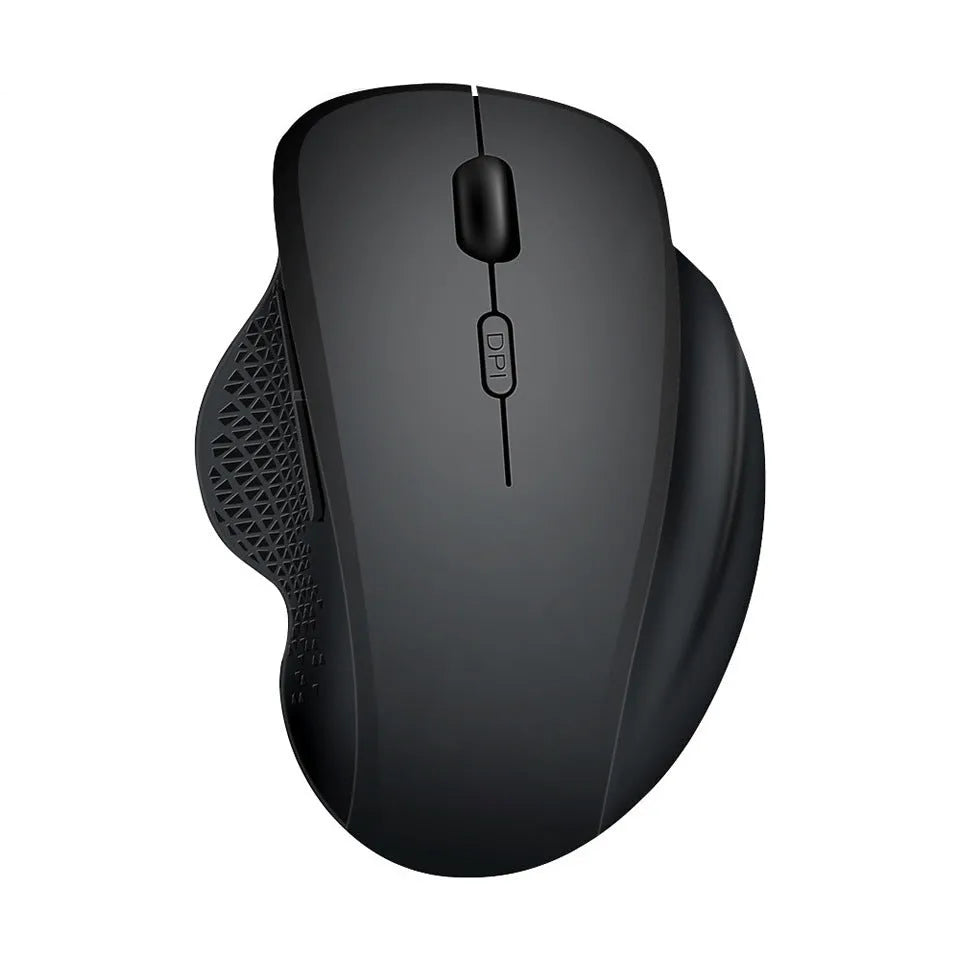 Black wireless laptop mouse with USB-C charging cable on desk next to laptop