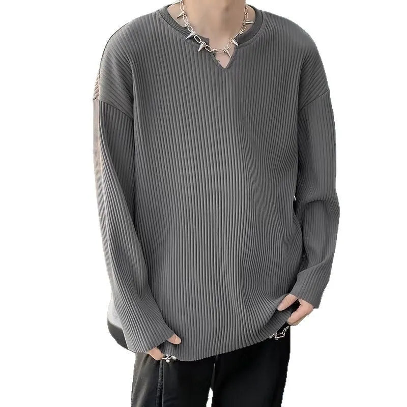 Women's plus size striped texture pullover top in grey, showing loose fit and long sleeves.