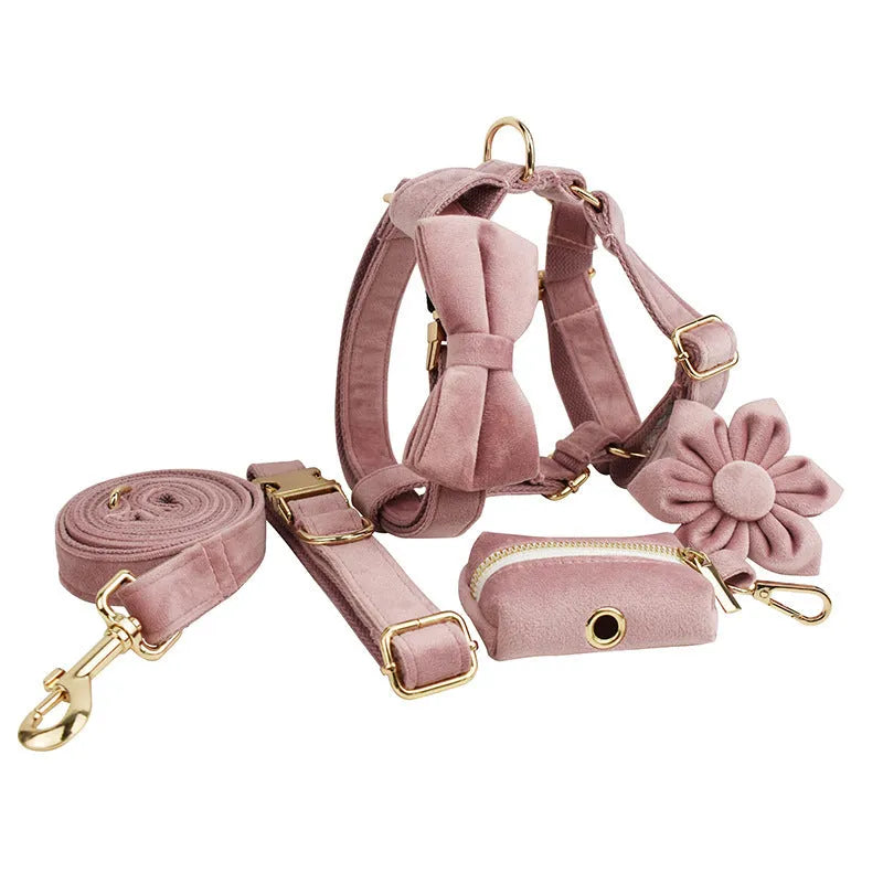 Light purple pink velvet dog collar set with leash and matching accessories on cloth material
