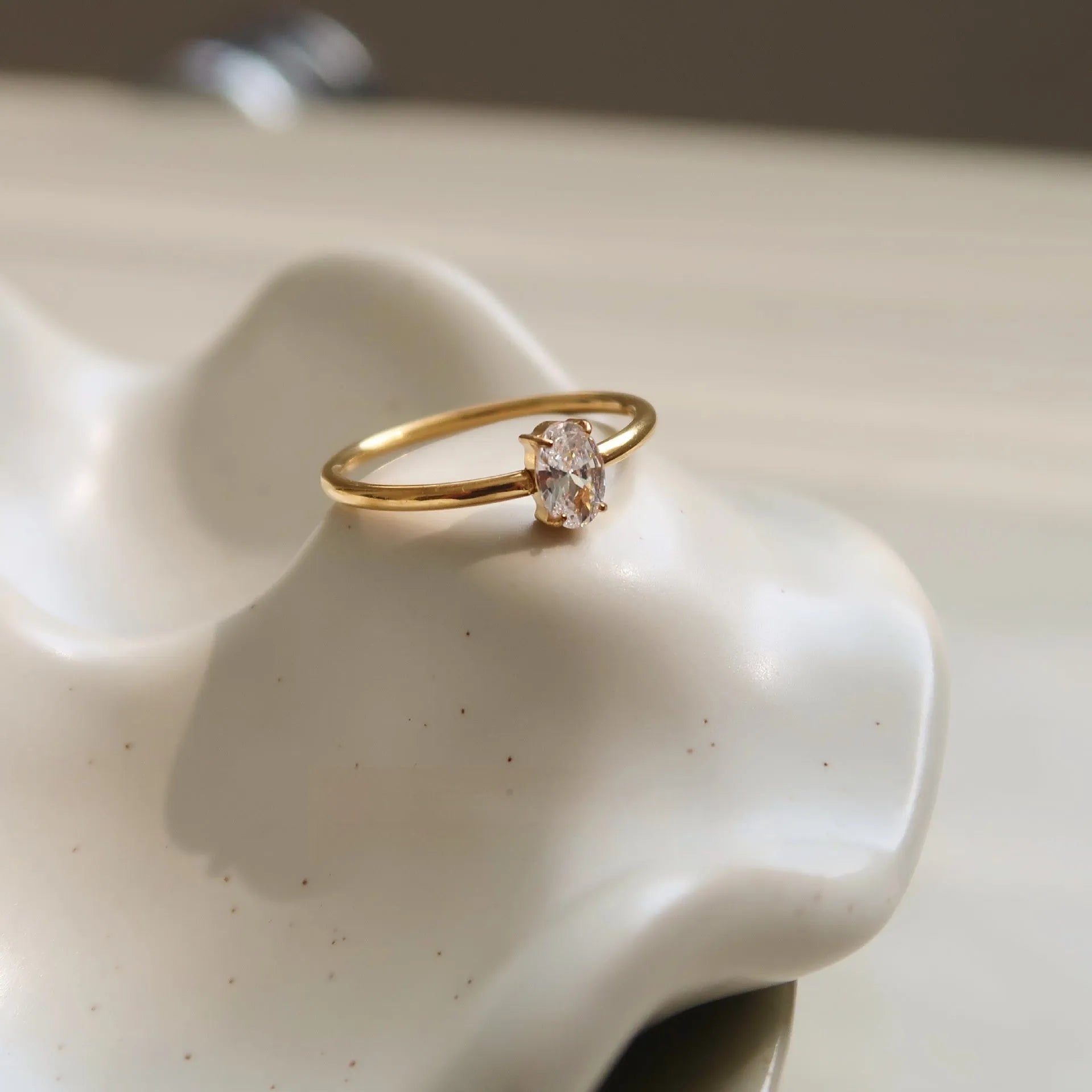 Golden stainless steel ring showing love heart and oval shape options, displayed next to size markers 5, 6, 7, 8.