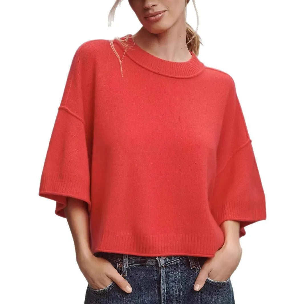 Red short sleeve viscose T-shirt with an exposed navel crop design on a model.