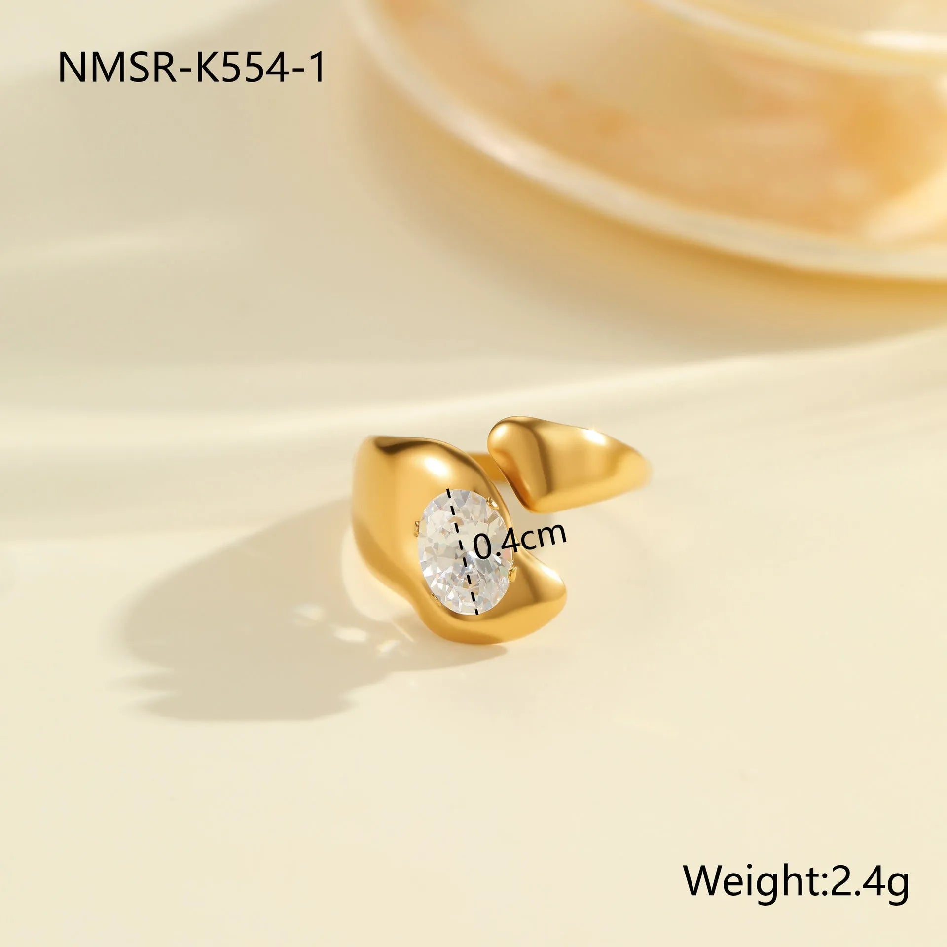 Geometric stainless steel zircon ring with open mouth design on a hand.