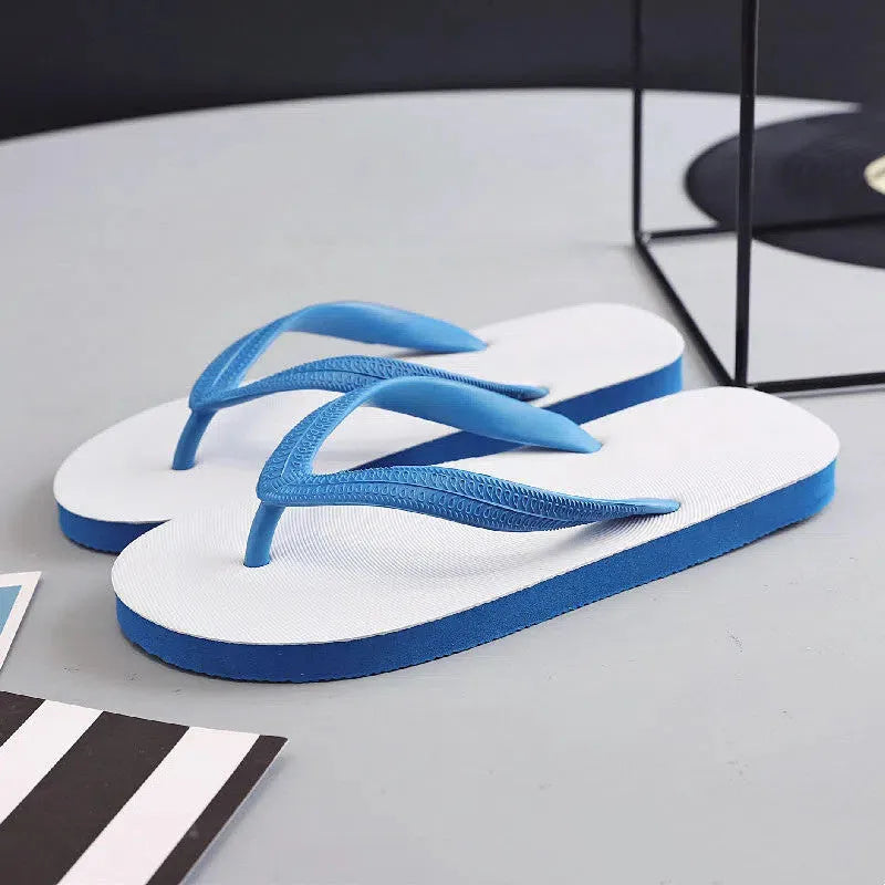Rubber flip-flops with fish label design in green, red, blue, or black colours on a simple background.