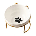 White ceramic pet bowl with decorative pattern in iron frame with cat ear accents