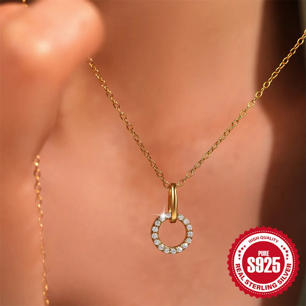 Gold colour geometric sterling silver necklace with interlocking design and zircon details on adjustable chain