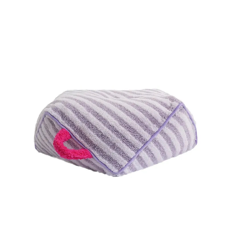 Striped plush pet bed for cats and dogs with a removable washable cover in yellow, orange, or purple.
