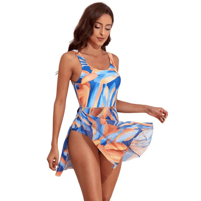 Women's single shoulder one-piece swimsuit with colourful floral print and slim waist design.