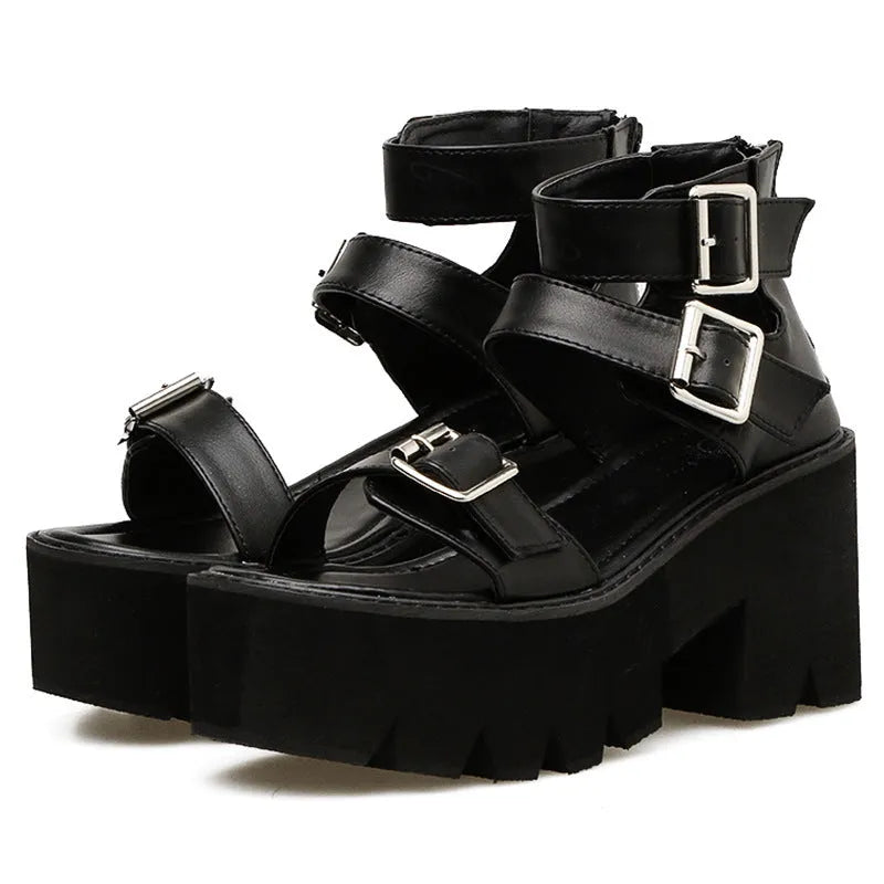 Black women's Roman style platform sandals with a chunky heel, round toe, back zipper, and decorative buckle.