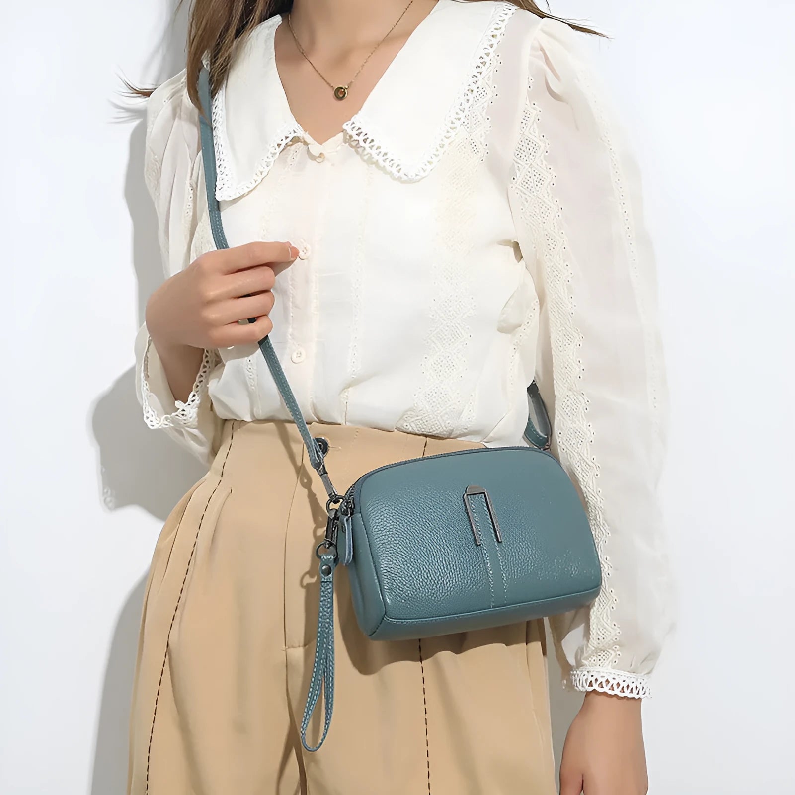 Women's genuine leather square shoulder bag in dark khaki colour, showing structured horizontal shape.