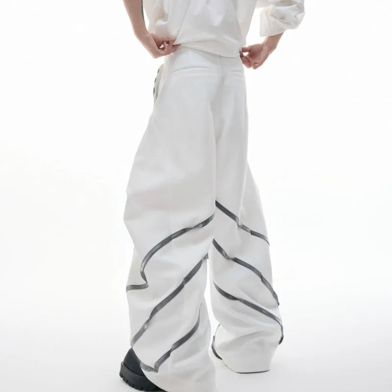 Men's trousers with metal striped rivet pleated design showing three-dimensional cutting detail