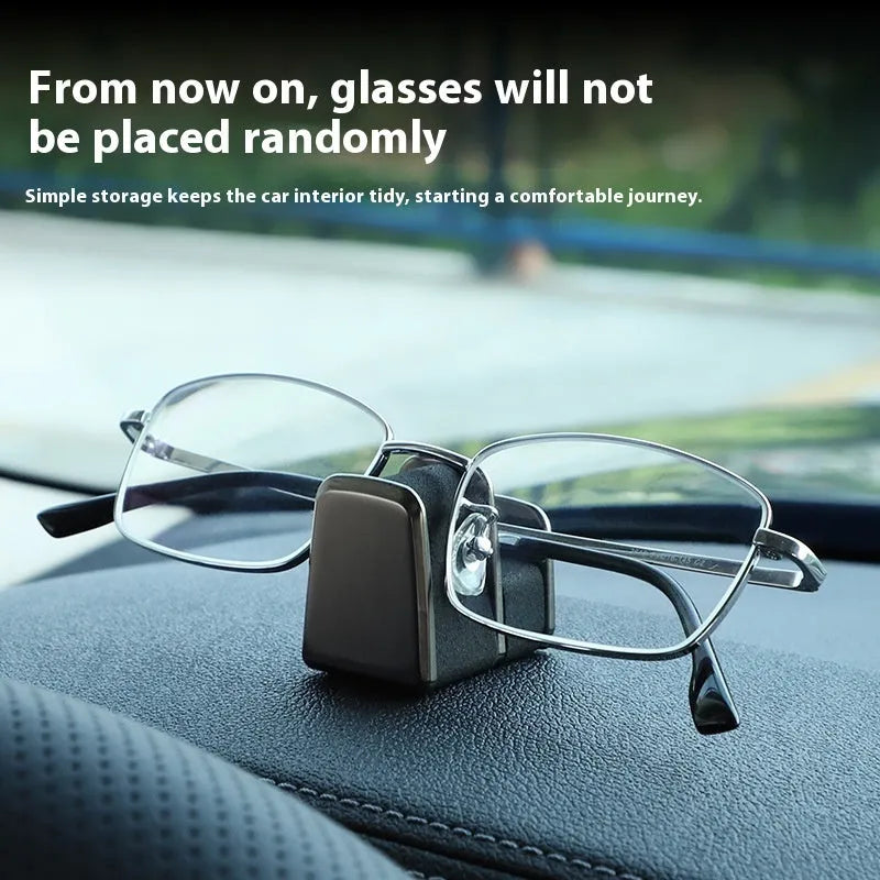 Zinc alloy and leather sunglasses clip for car dashboard in green, black, grey, or red.