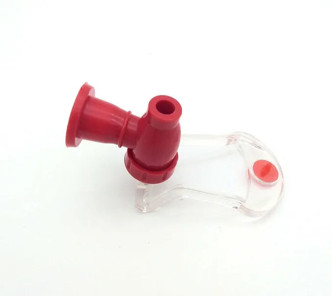 Red plastic Magic Tap soda dispenser attached to 2-litre bottle with push-button tap