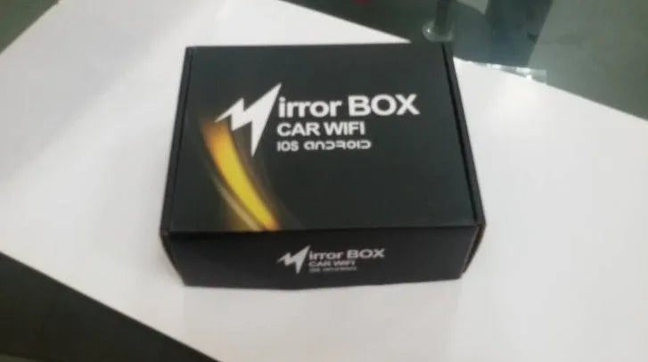 Black car Wi-Fi mirror link box with power cable, antenna, AV cable, and user manual for smartphone screen mirroring.