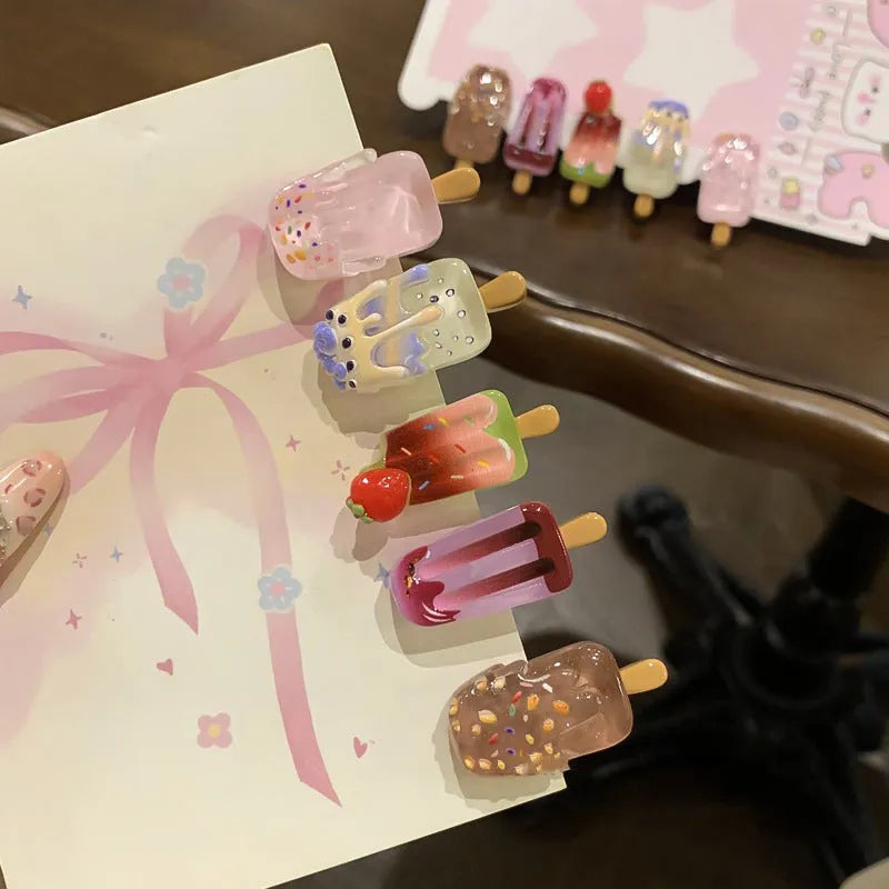 Resin ice cream design hair barrette with side clip fastening.