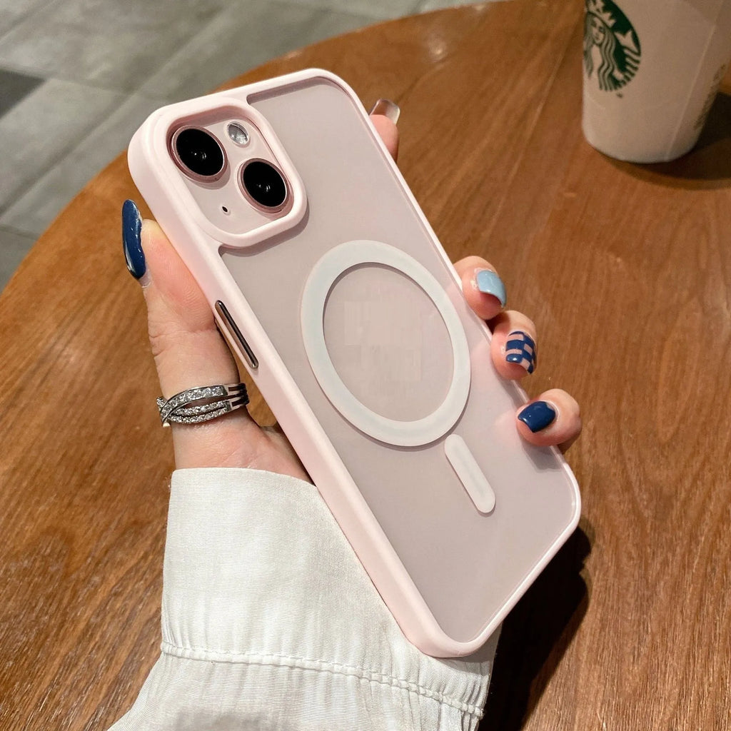 Transparent acrylic MagSafe phone case for iPhone on a table, showing magnetic ring and clear back.