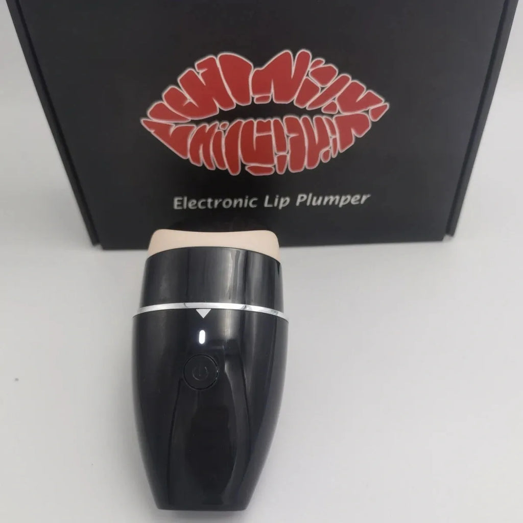 Black and white electric silicone lip plumper device with USB cable.