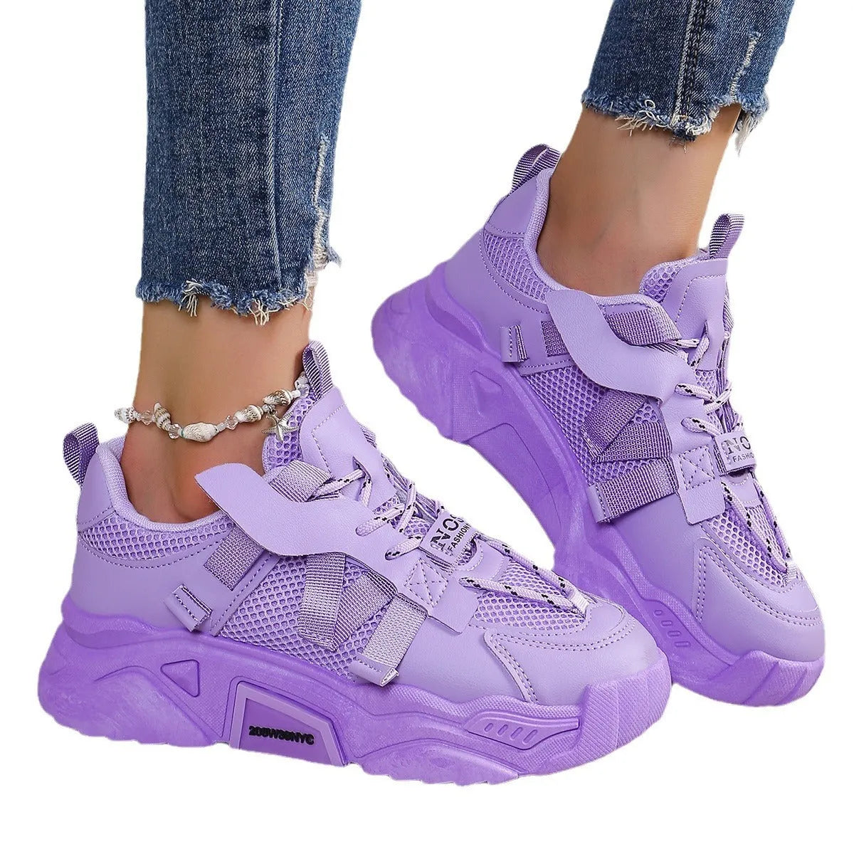 Women's platform sneakers in purple with mesh upper, animal pattern detail, and lace-up front.