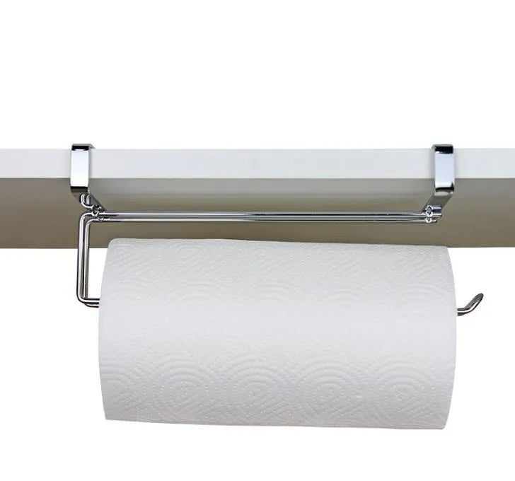 Silver stainless steel paper towel rack mounted on a kitchen cabinet door
