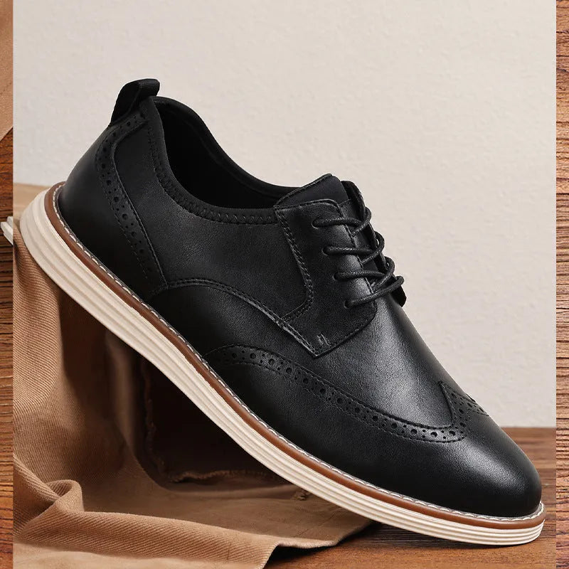 Men's black slip-on casual shoe with round toe and carved detail on the PU upper.