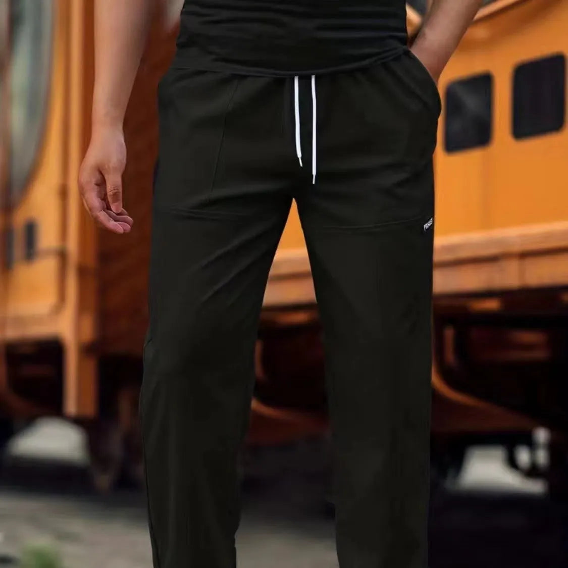 Men's casual polyester trousers for spring and autumn in light grey colour.