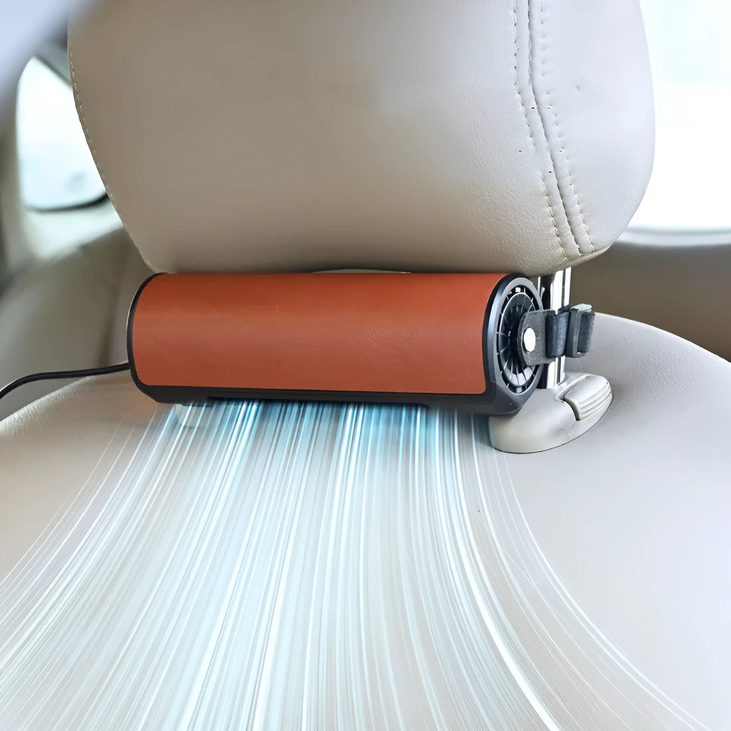 Compact black USB-powered car fan for rear seats with a long cable on a car seat