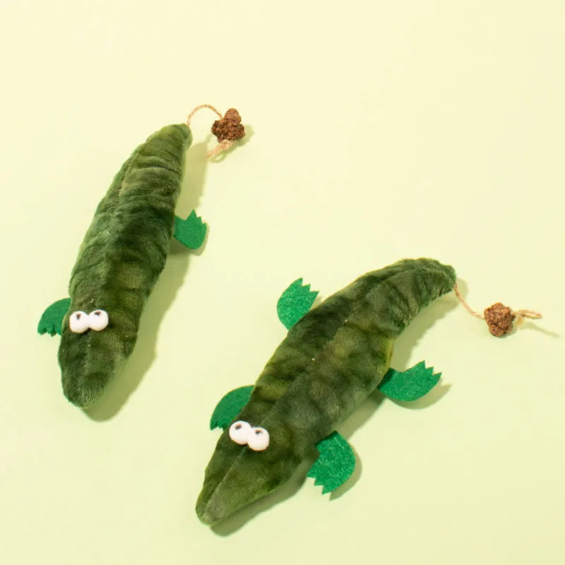 Green plush alligator cat toy with plant-based catnip filling for feline oral cleansing and stress relief