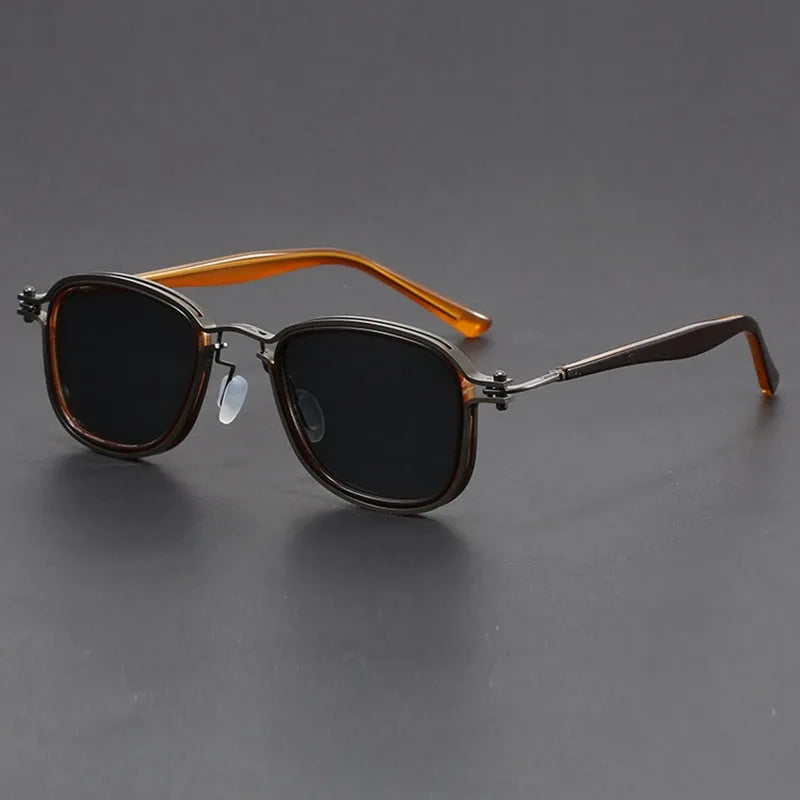 Retro style square sunglasses with a mixed metal and plastic frame and AC lenses.