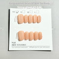 Set of velvet frosted Cat's Eye false nails in short ladder XS, S, and M sizes on a display stand.