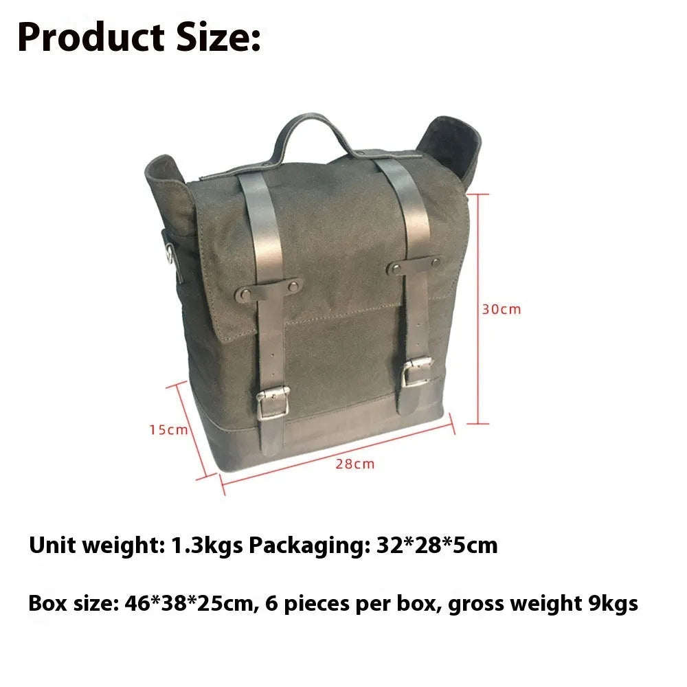 Waterproof canvas motorcycle side pannier bag in black mounted to motorcycle