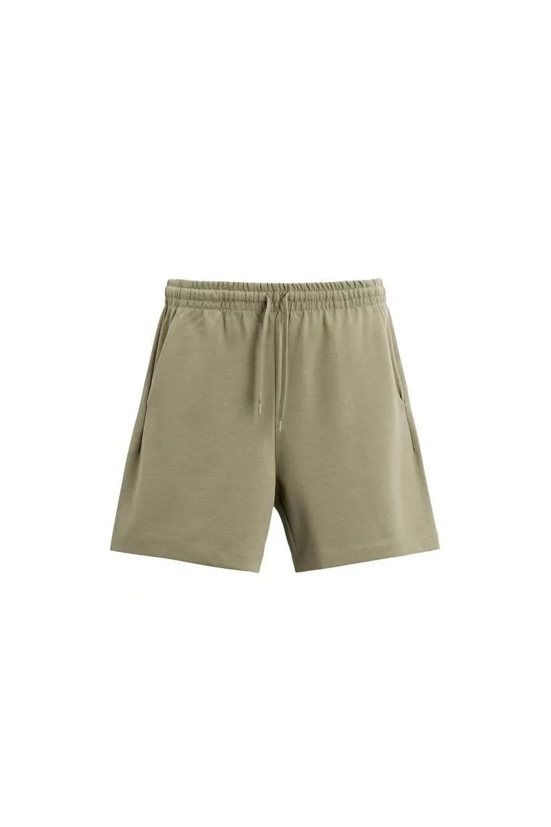 Loose blue polyester T-shirt and matching shorts set on a hanger, showing round neck and double-sided texture.