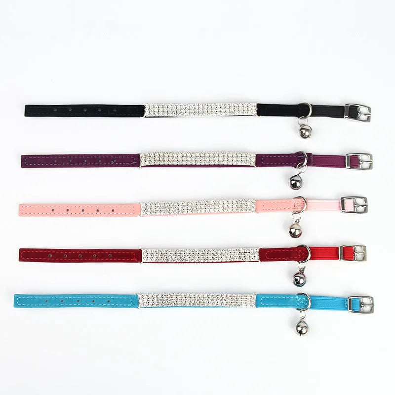 A red velvet cat collar with rhinestones on an adjustable band.