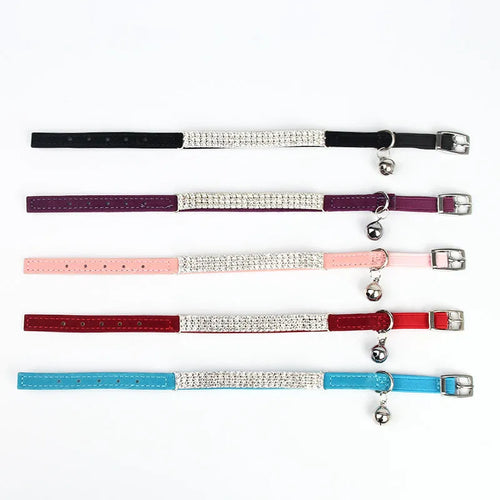 Adjustable red velvet cat collar with rhinestone details on a suede strip.