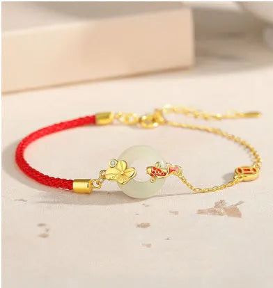 Women's koi peace buckle bracelet in 925 silver with electroplated gold finish on red rope