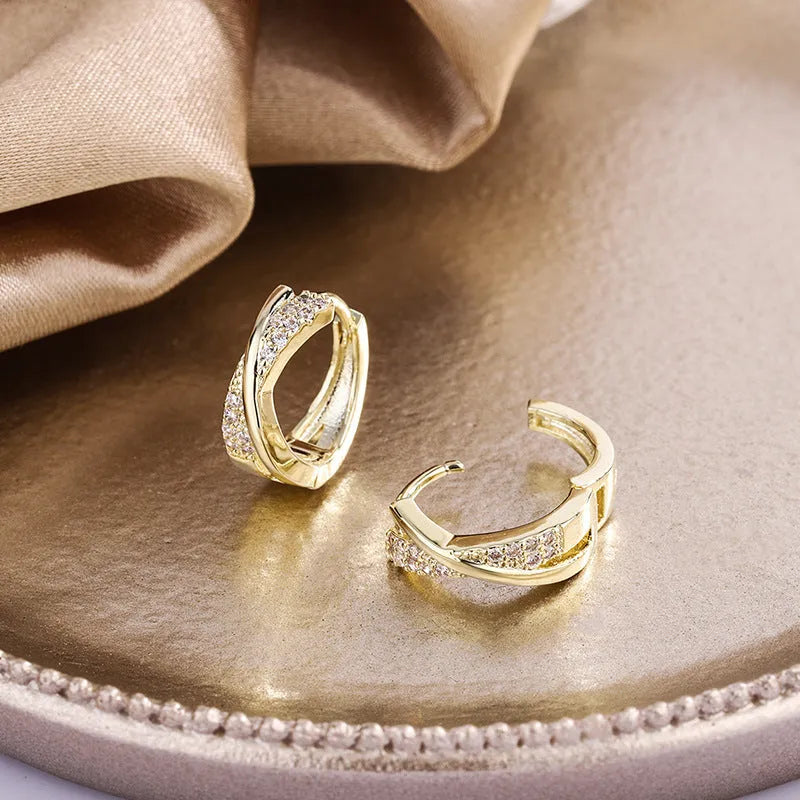 Geometric earrings with copper construction and 14K yellow finish featuring zircon sparkle treatment