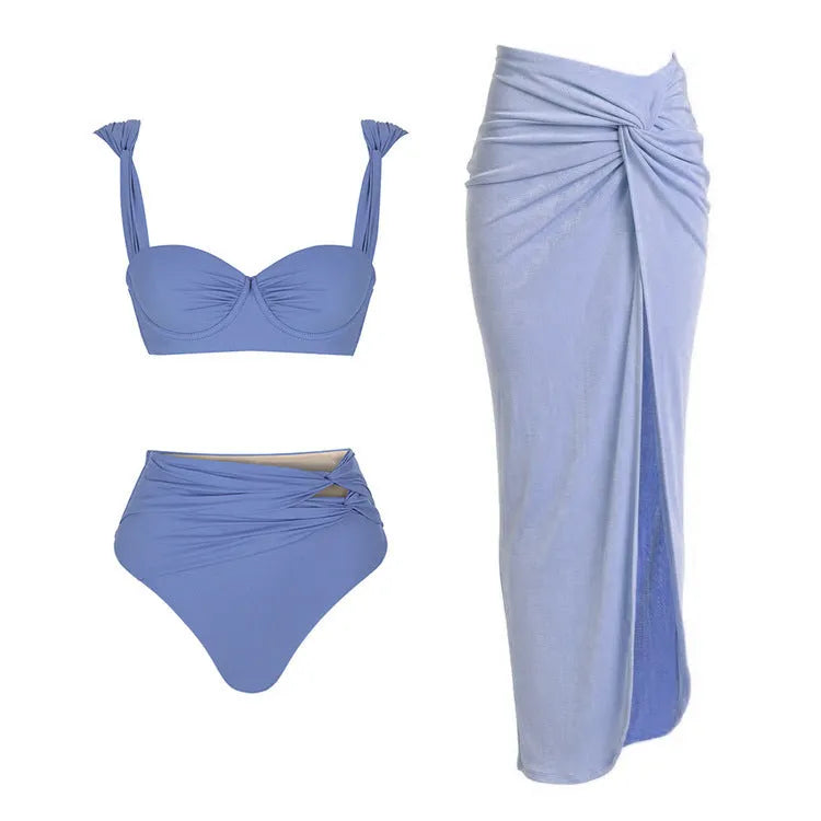 Women's solid-colour one-piece swimsuit with gold button and matching skirt in assorted colours.