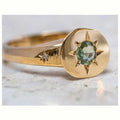 Golden oval ring with star asterism design and adjustable opening mechanism