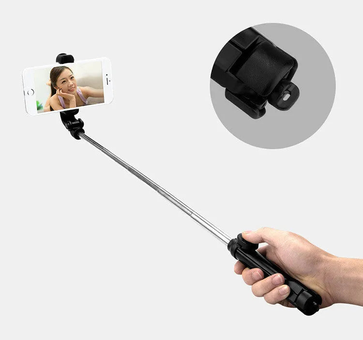 Bluetooth remote control mobile phone tripod stand extended with phone attached
