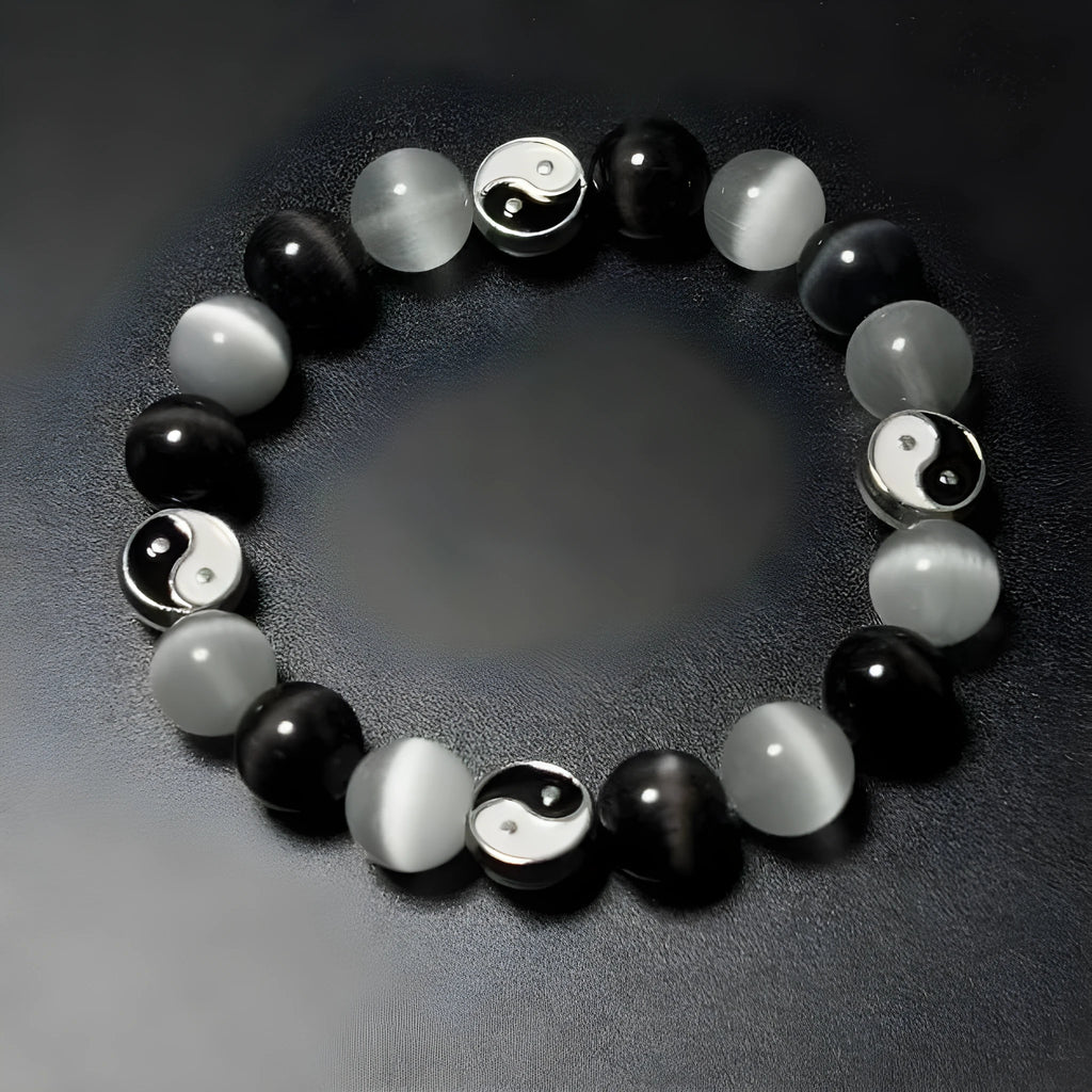 Close-up of a 10mm natural opal and black agate beaded Tai Chi bracelet for men and women.