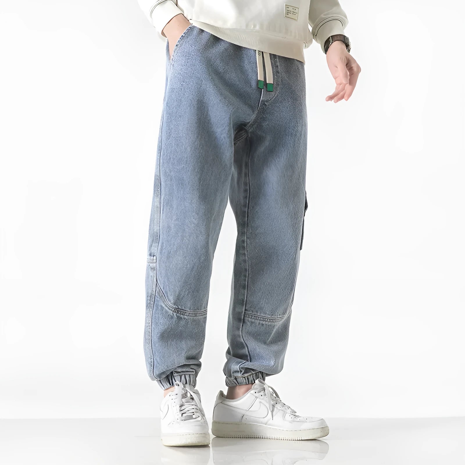 Men's cotton loose-fit tapered trousers in black, blue, or grey with mid-waist design