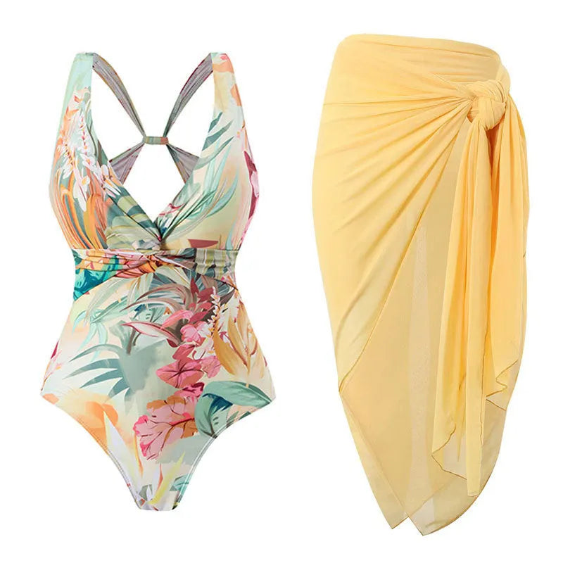 Women's yellow floral vintage print one-piece swimsuit with short sleeves on a mannequin.