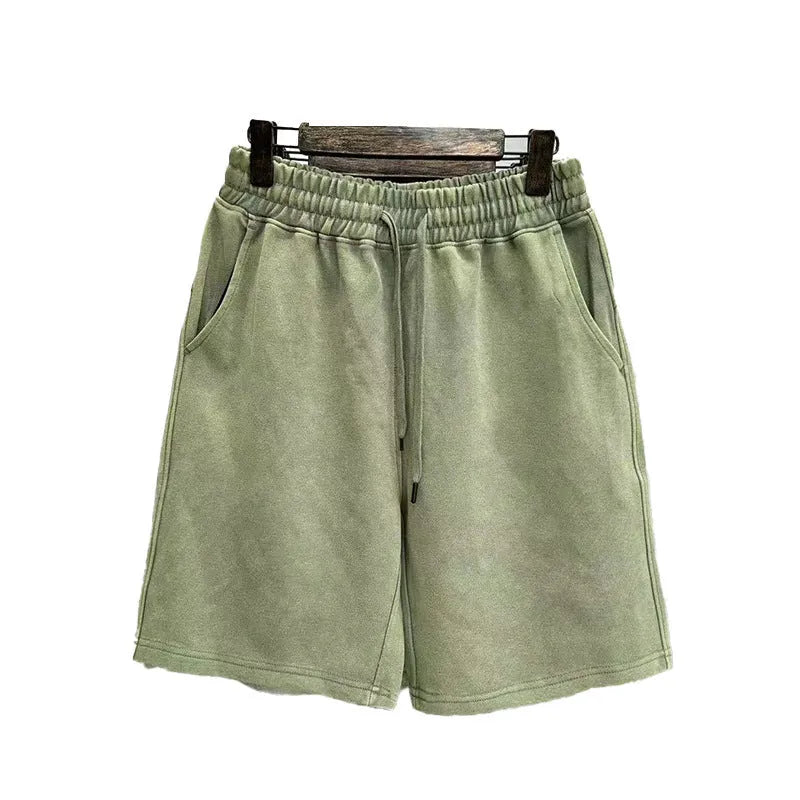 Men's straight-leg cotton casual shorts in distressed navy blue colour showing loose fit and fifth-pants length