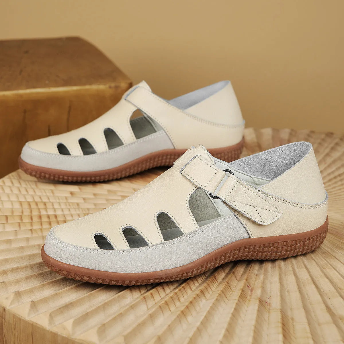 Women's plus size blue flat sandals with a hollow-out toe cap and thick rubber sole.