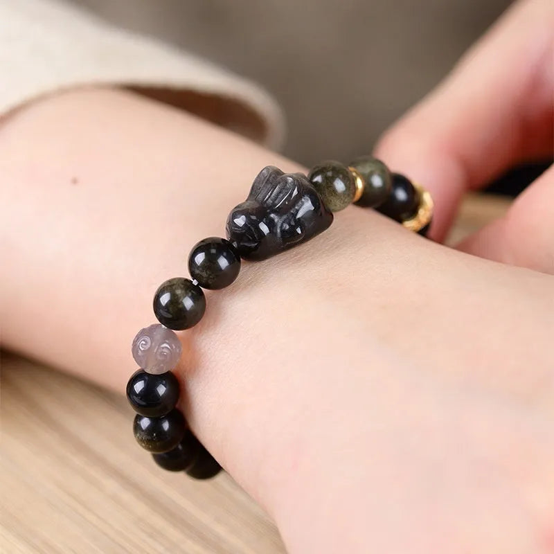 Handmade national style bracelet with lying rabbit charm made from jin yaoshi, agate, and brass.