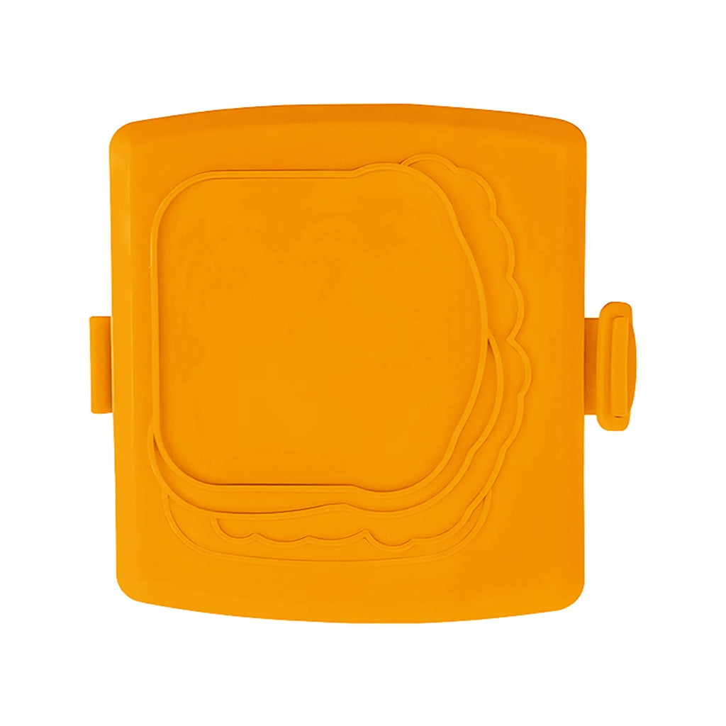 Red silicone baking tray with hand clamp attachment showing anti-scald design