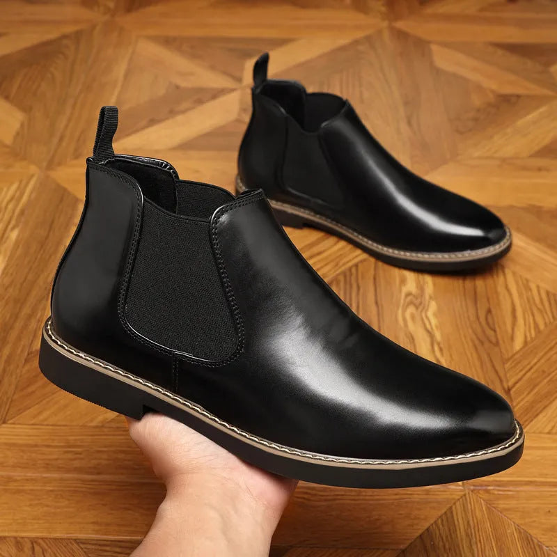 Men's black formal leather boots with a pointed toe and square heel on a non-slip rubber sole.