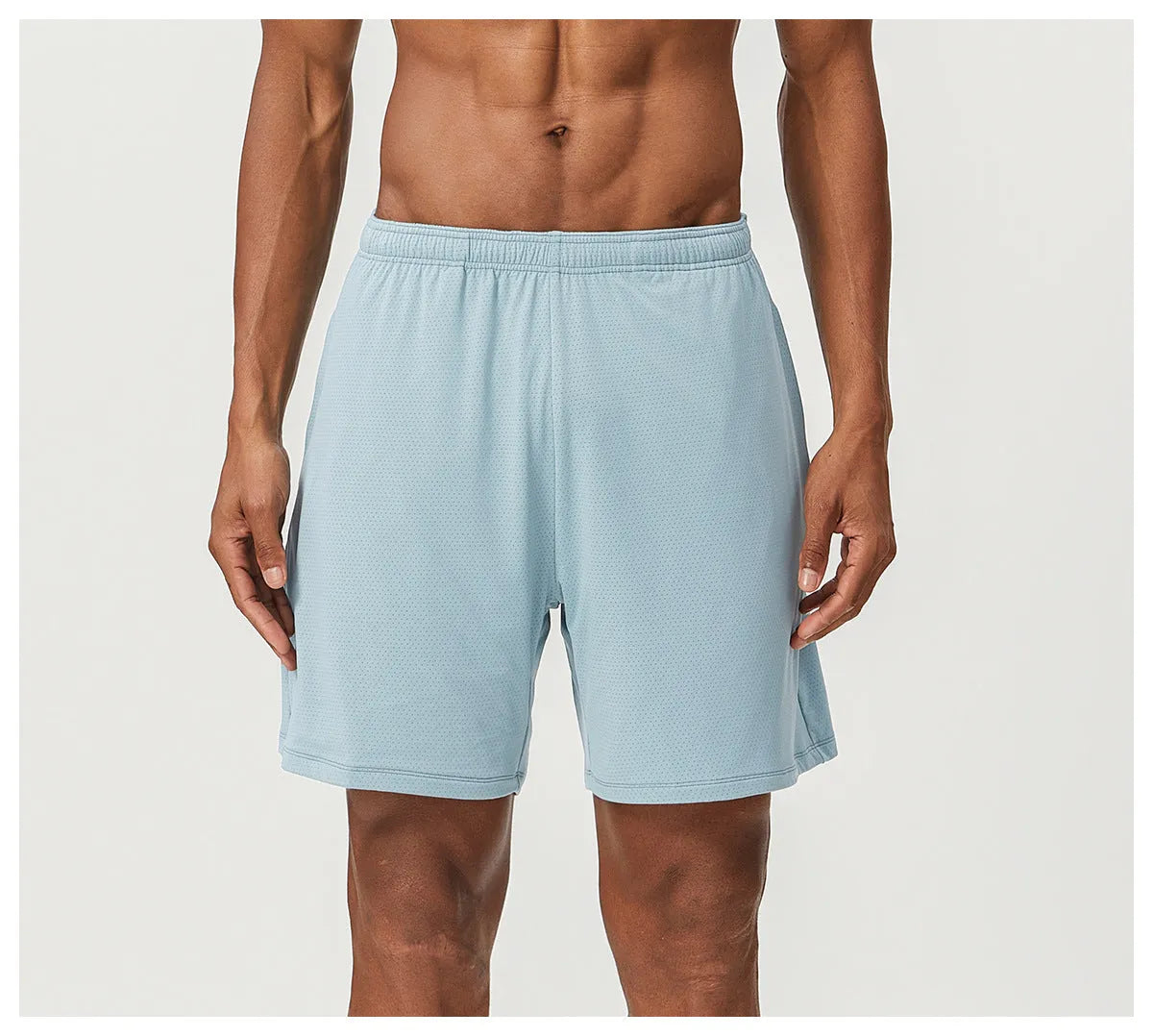 Men's double-layer quick-drying running shorts in brick red colour on a mid-waist model.