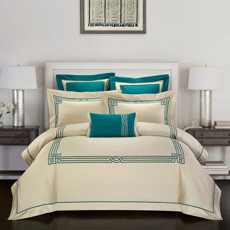 A four-piece cotton bedding set with embroidery, shown in one of five available designs.