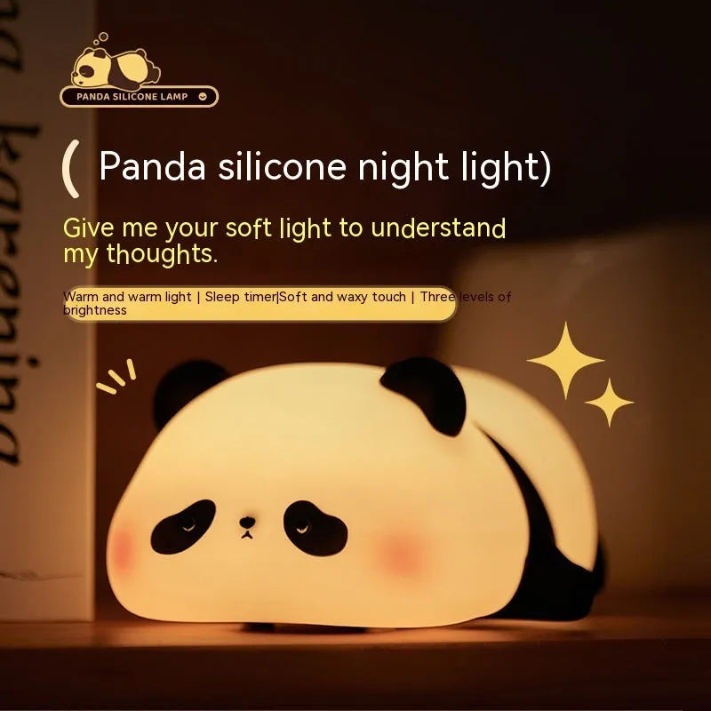 Cartoon panda head rechargeable night light with warm white glow on bedside table